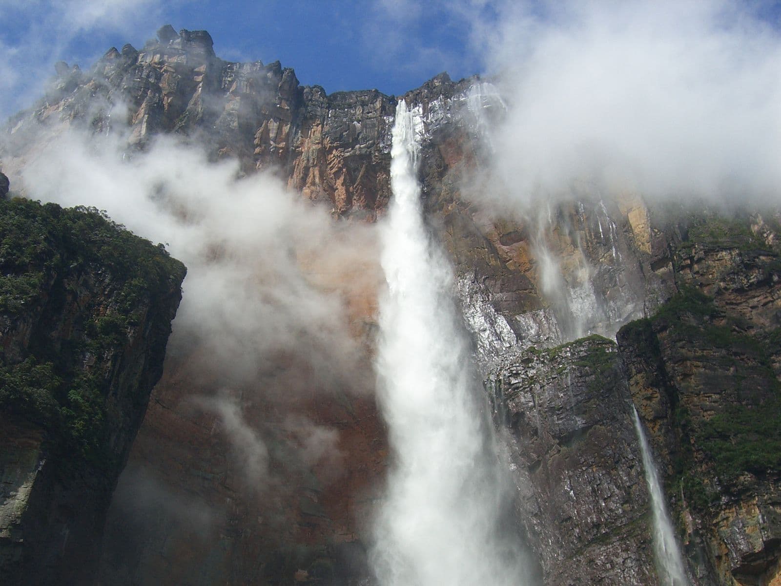 Salto Ángel (Angel Falls) dropping through clouds from the wall of Auyantepui
